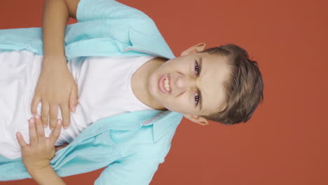 Vertical-video-of-Boy-experiencing-stomachache.